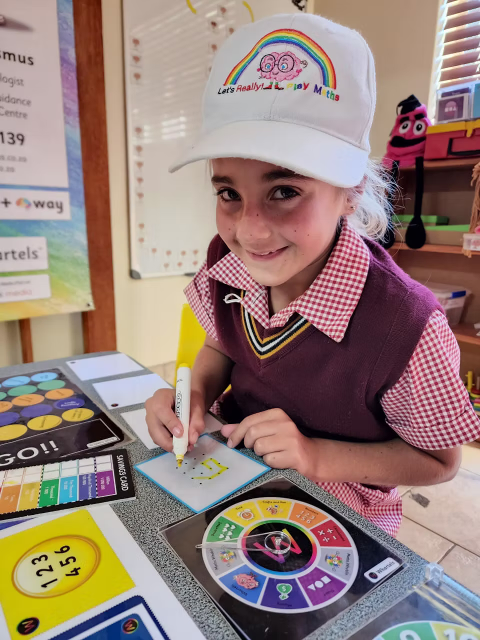 Child learning maths with the Let's Really Play board game